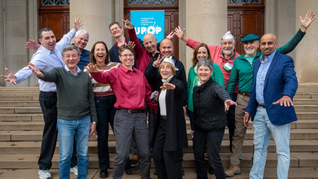 Fourteen UPOP mentors together on the steps of MIT campus